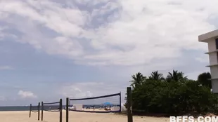 Volleyball match on the beach with sexy bikini babes