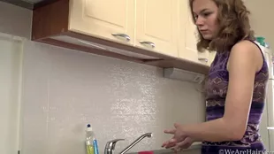 A kitchen-confined European girl explores her own pleasure